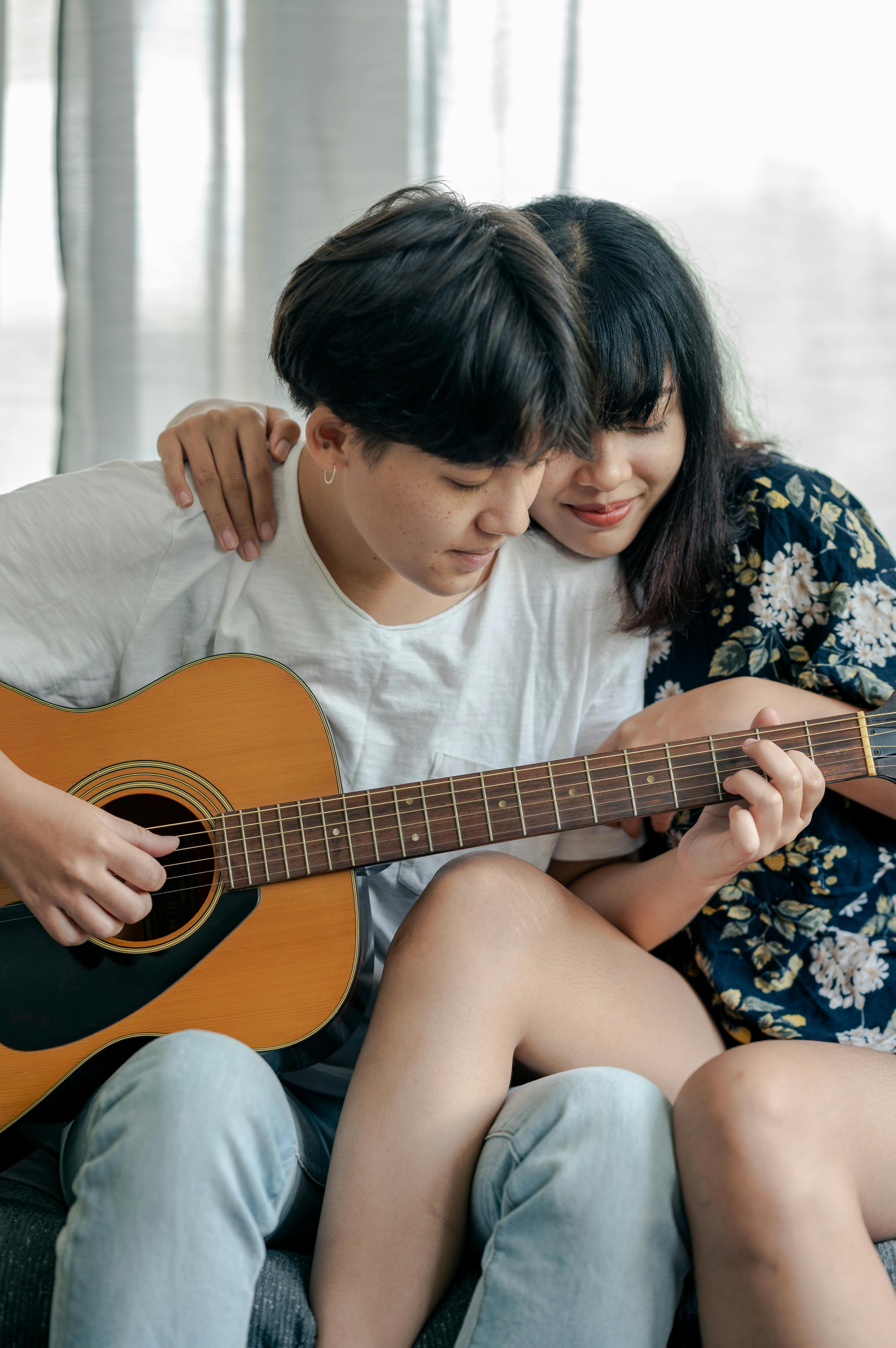 sad boy and girl with guitar