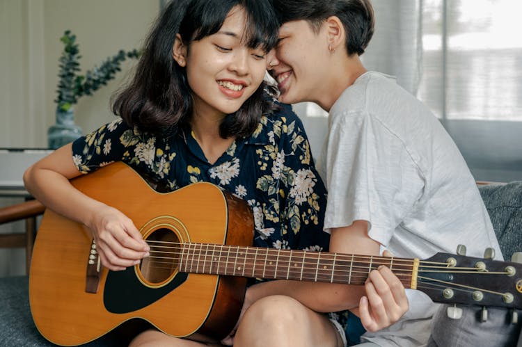 Couple Playing Guitar