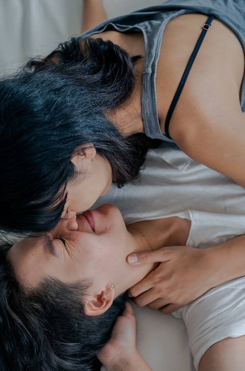 A Couple Lying on Bed