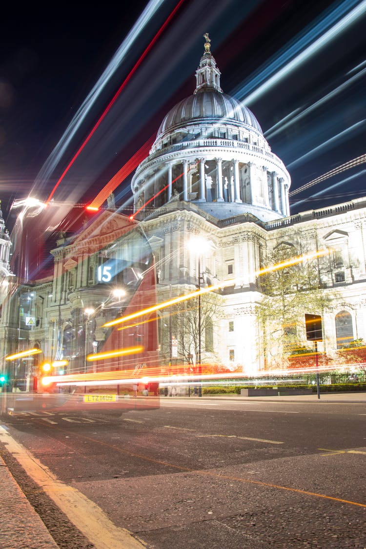 Motion Blur Of Passing Bus In Front Of St Pauls Cathedral In London, UK