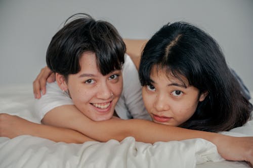 Free 
A Couple Lying Down in Bed Stock Photo