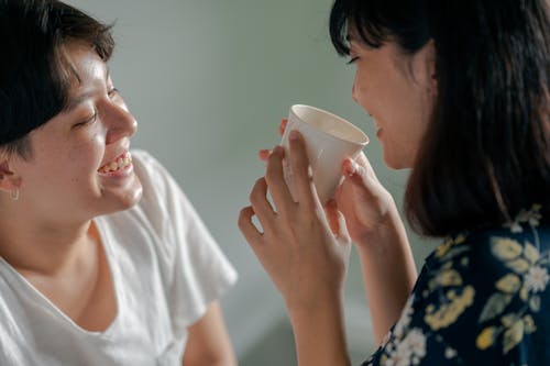 Free Photo of Couple Smiling While Looking at Each Other Stock Photo