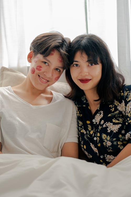 Free  Photo of Couple Smiling While Looking at Camera Stock Photo