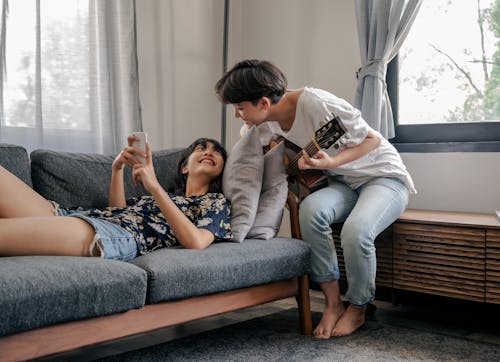 Free Photo of Couple Smiling While Looking at Each Other Stock Photo