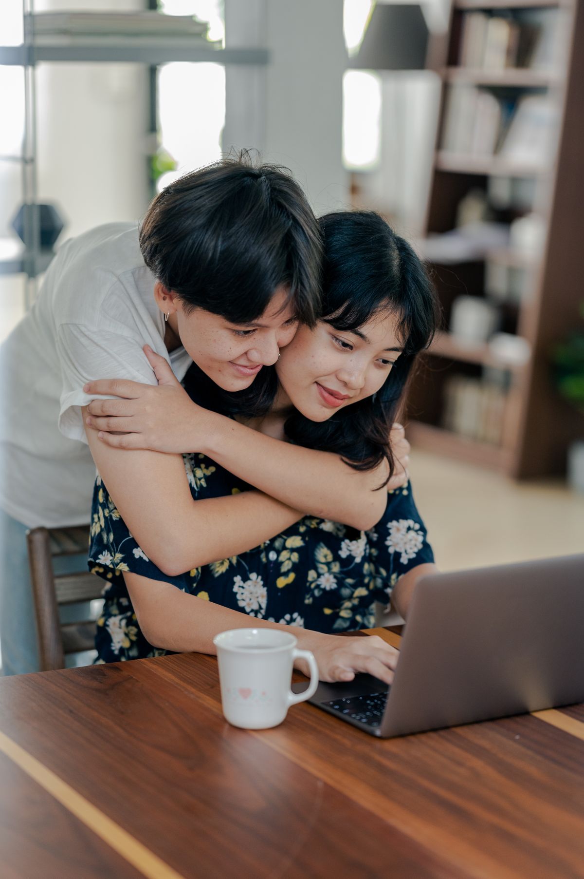 Couple looking at a laptop together