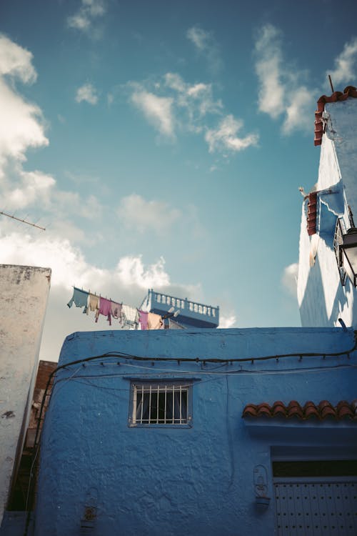 Blue Concrete Building Under the Blue Sky