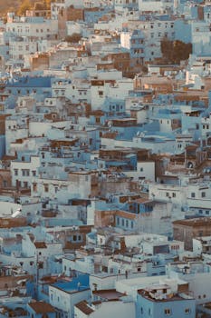 A stunning aerial view of the iconic blue buildings in Chefchaouen, Morocco.