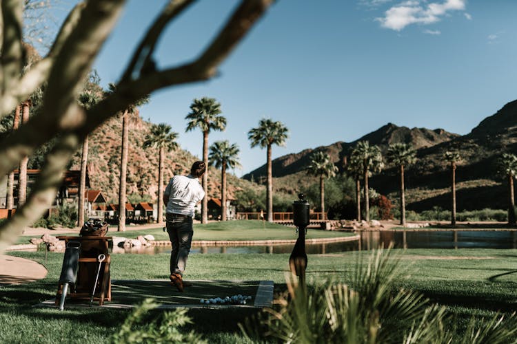 Photo Of Man Golfing On Grass Field