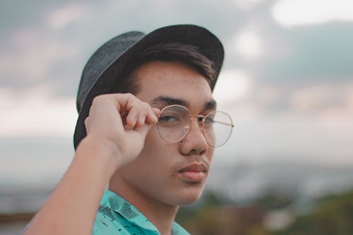 Shallow Focus Photo of Man Wearing Eyeglasses