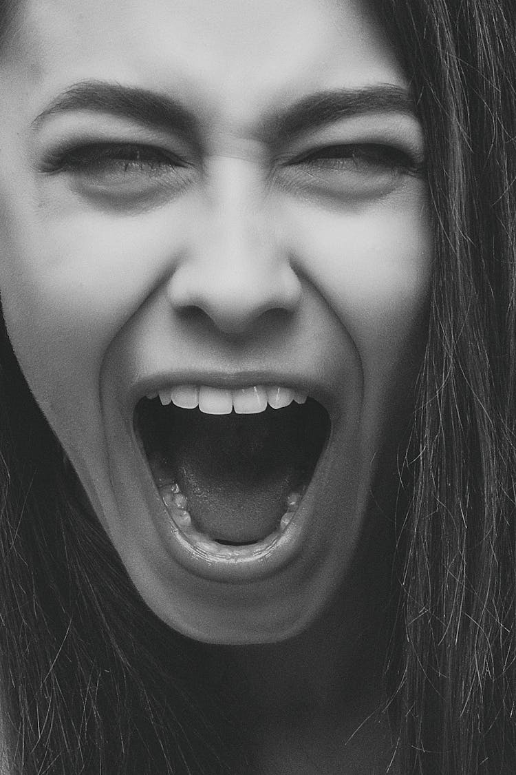 Grayscale Photo Of Person Screaming