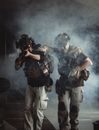 Photo of Men Walking While Holding Rifle