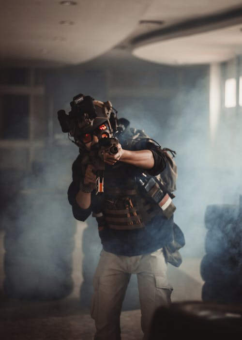 Photo of Man Holding Black Rifle