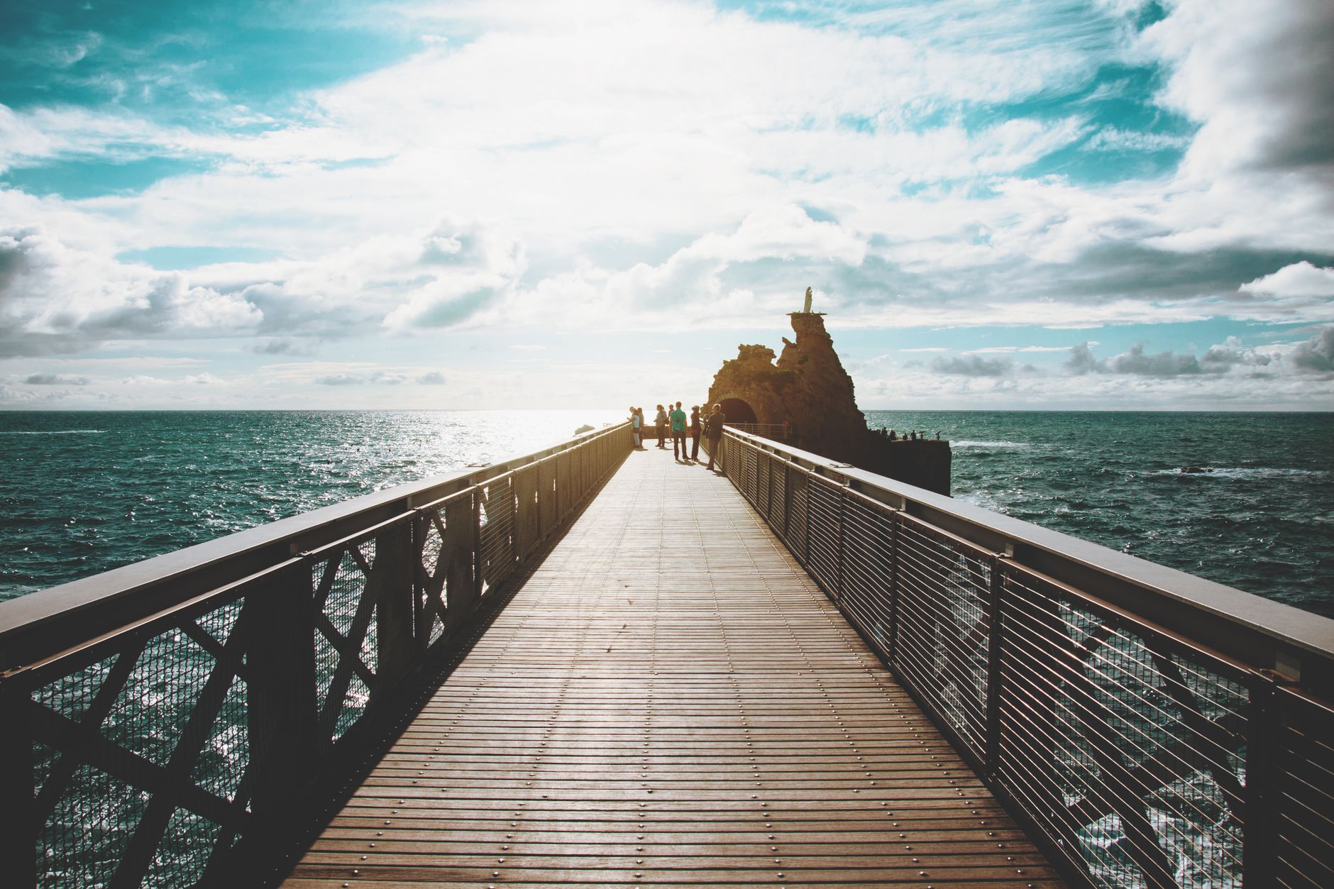 Stunning view of a bridge overlooking the ocean in Biarritz, France. Perfect for travel inspiration.
