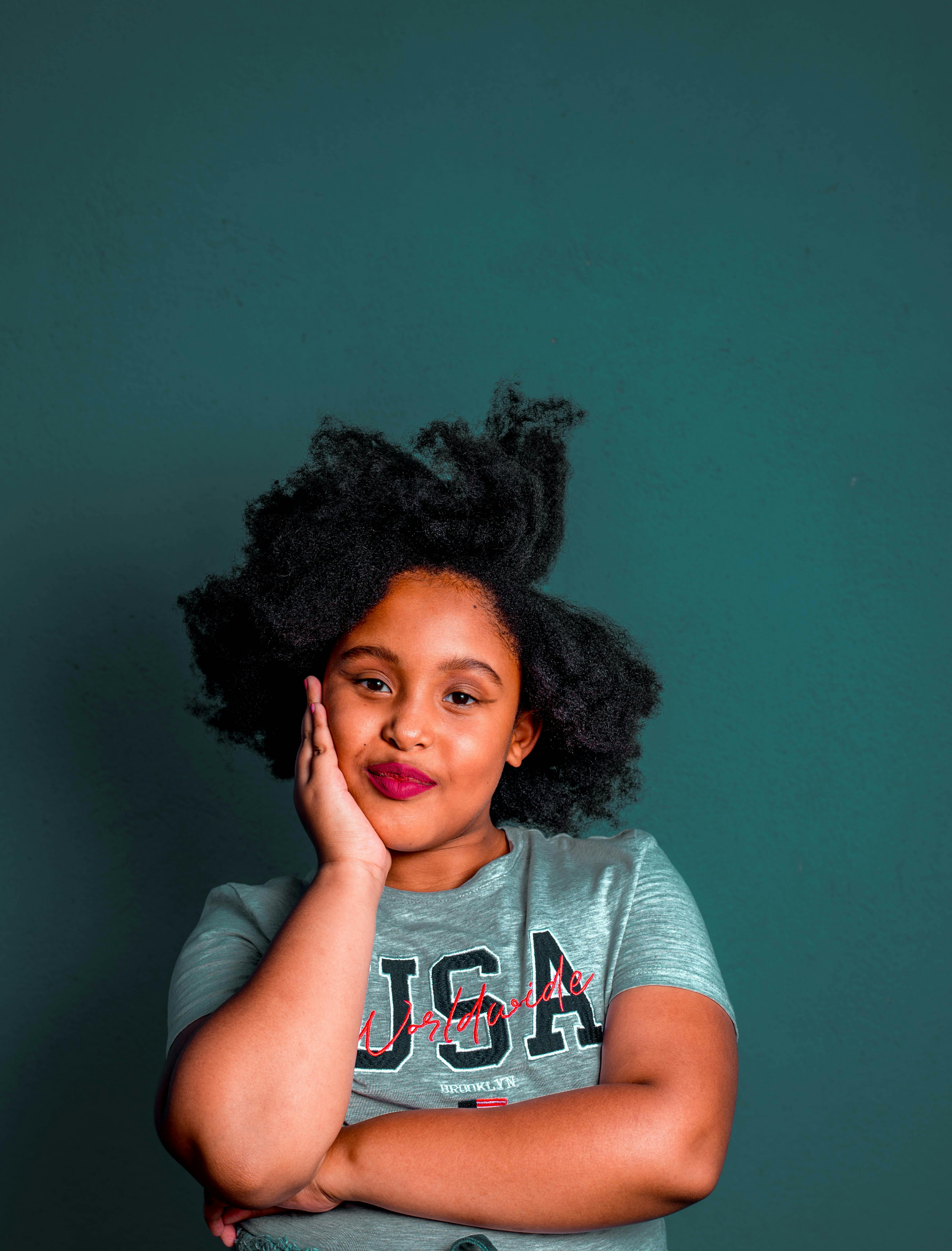 Smiling black woman in white t shirt and pants · Free Stock Photo