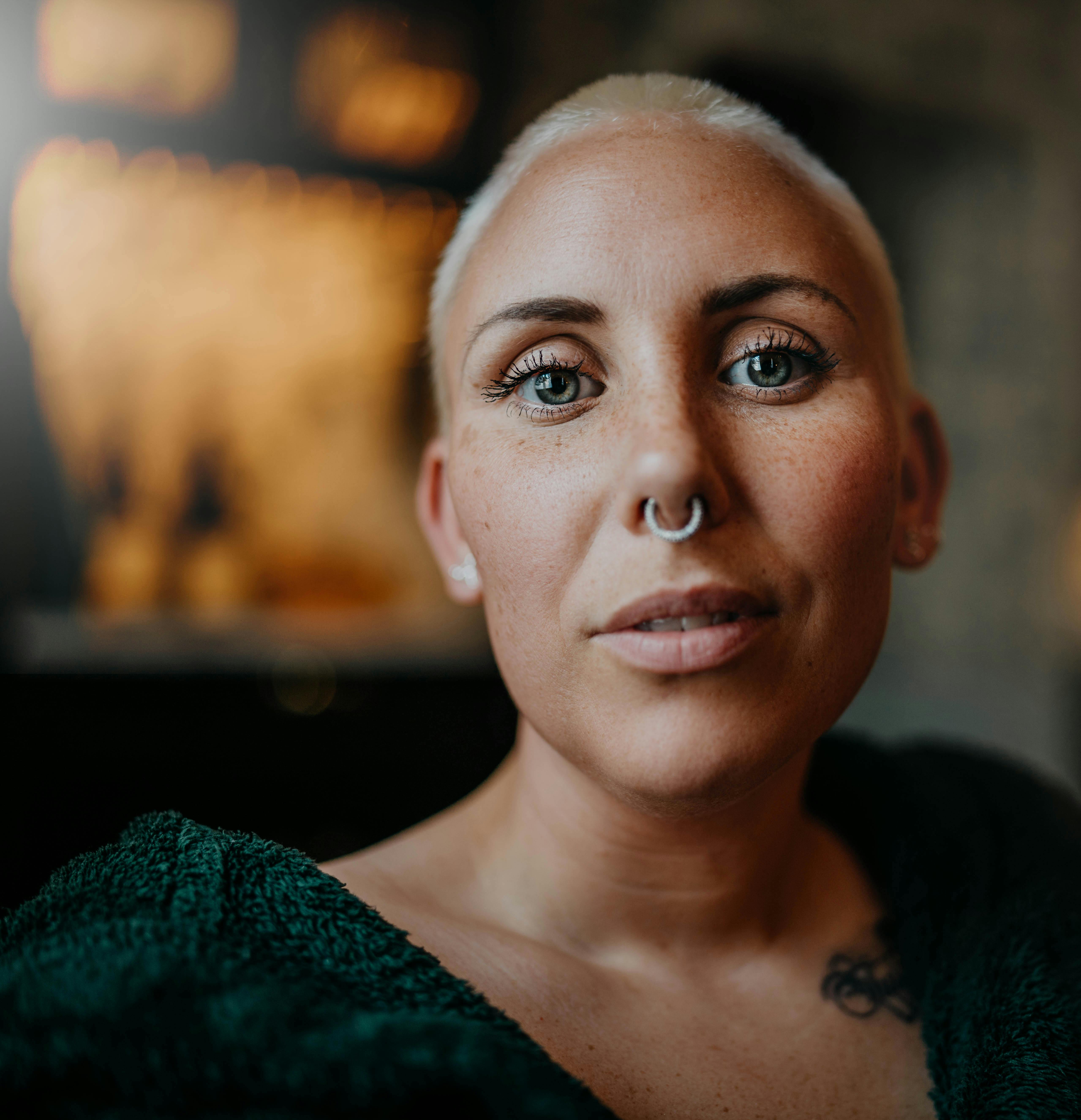 Portrait photo of a Man in white turtleneck tshirt with red string on
