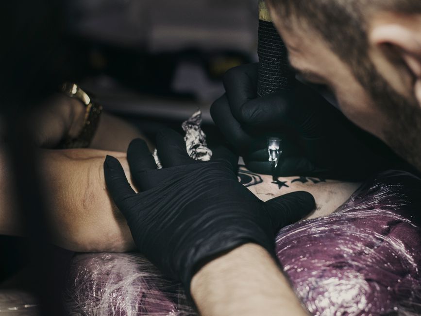 Step by step cover-up tattoo stencil placement over an existing tattoo Step by step cover-up tattoo stencil placement over an existing tattoo