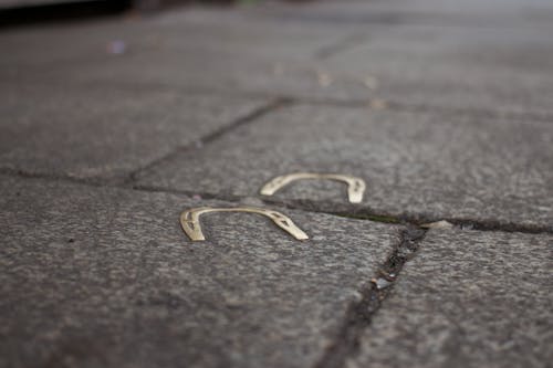 Horseshoe on Black Concrete Pavement