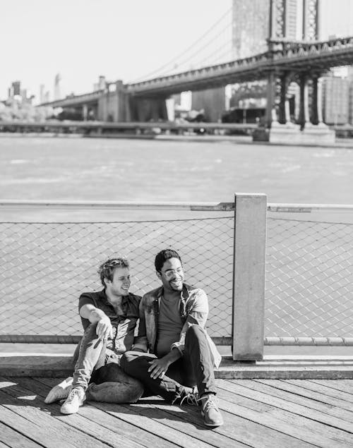 Free Two Men Sitting on the Floor and Smiling Stock Photo