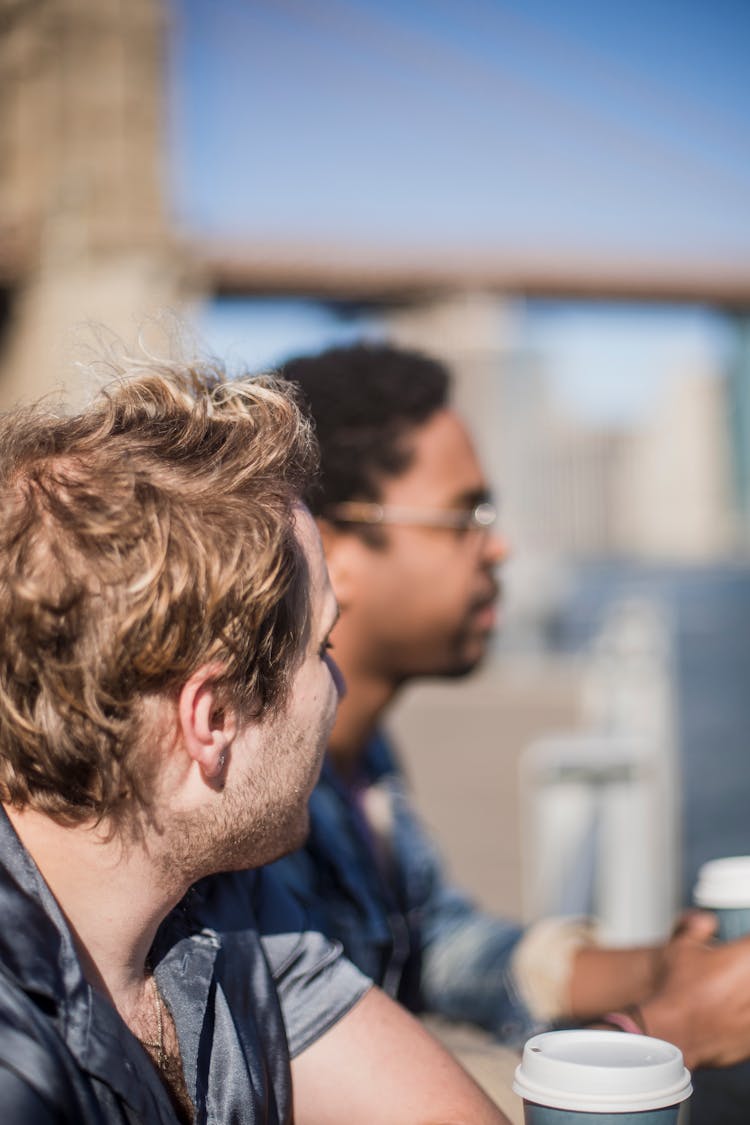 Portrait Of Two Men Enjoying Coffee