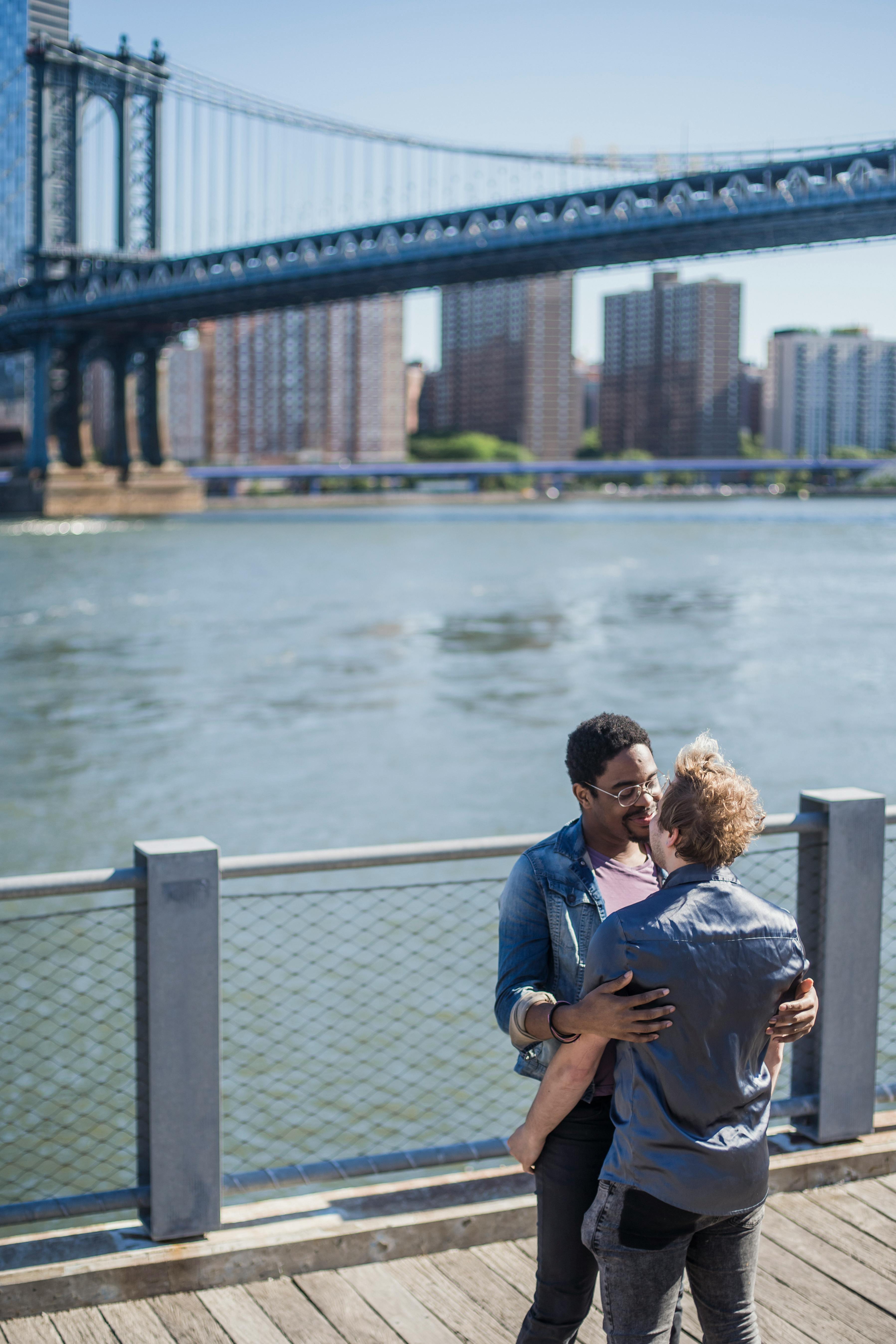 two men hugging outside