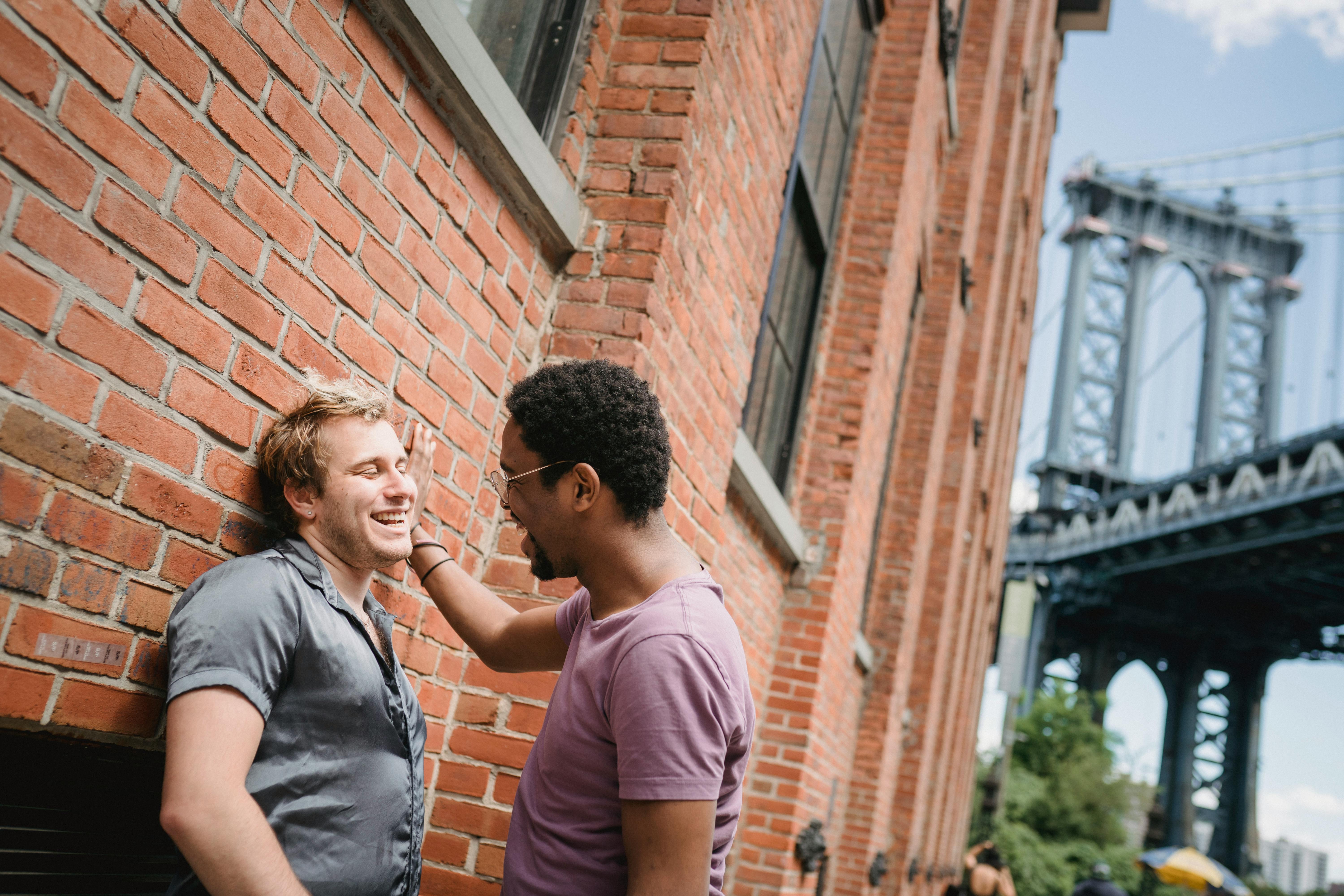 two men smiling and looking at each other