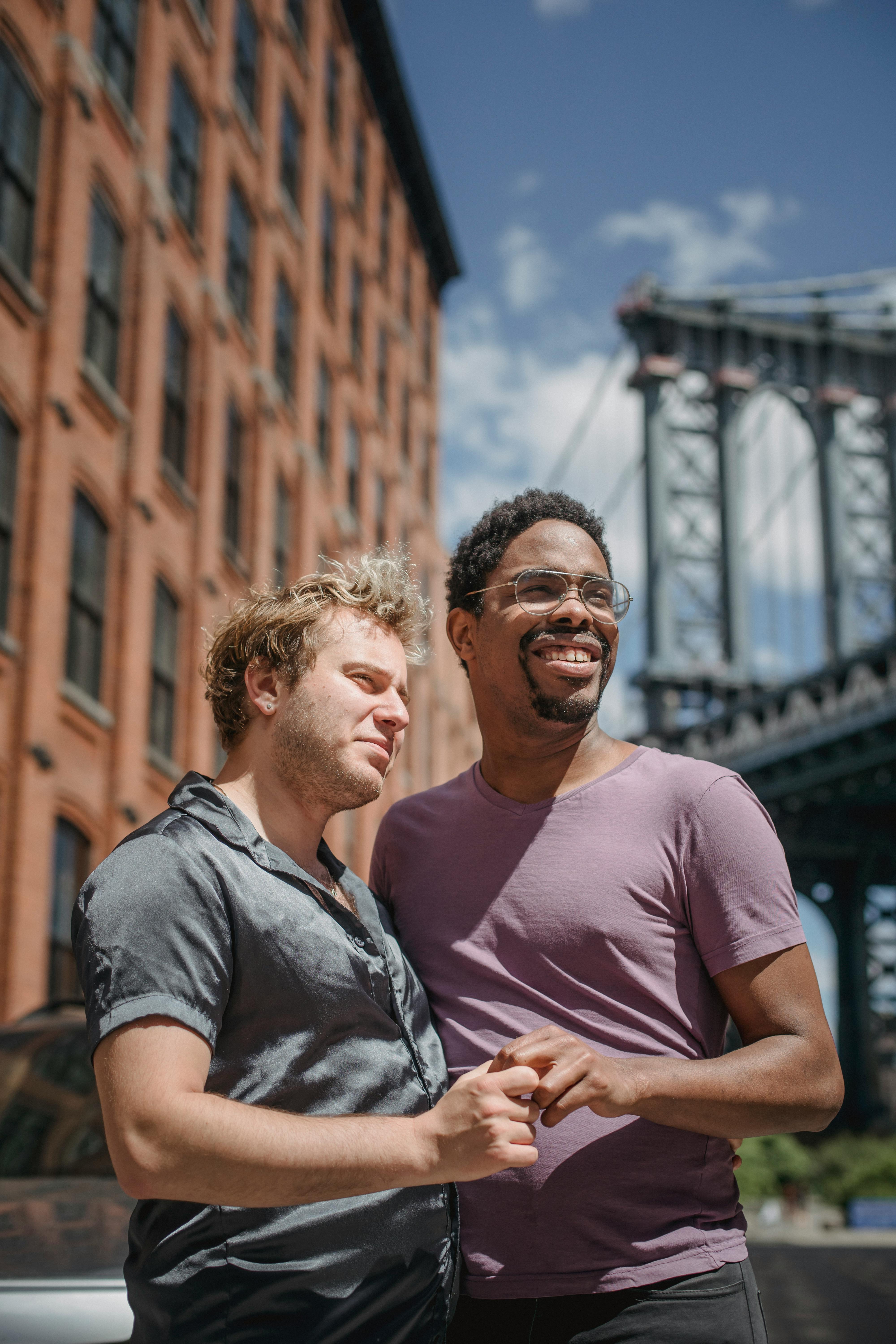 two men holding hands