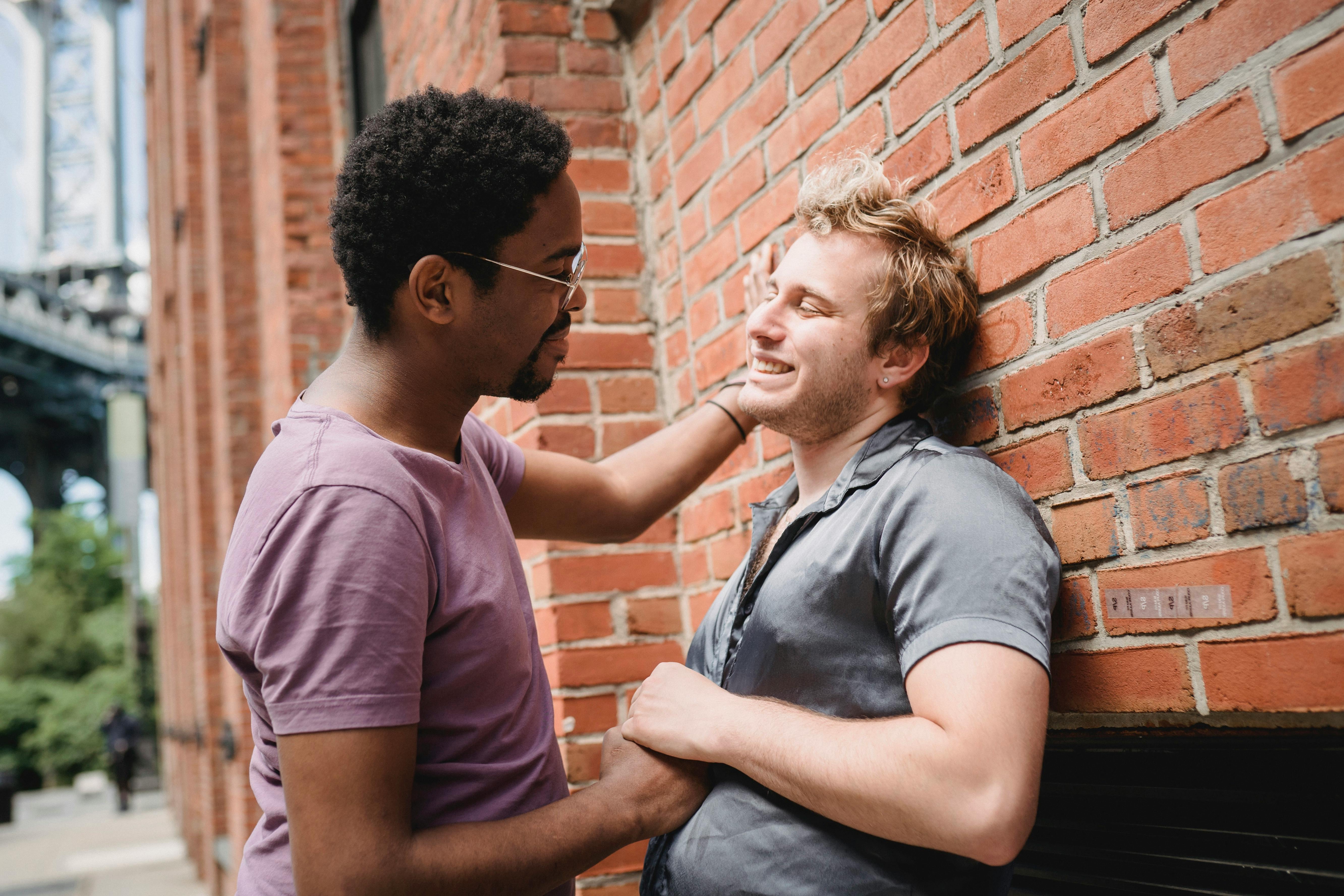 two men holding hands