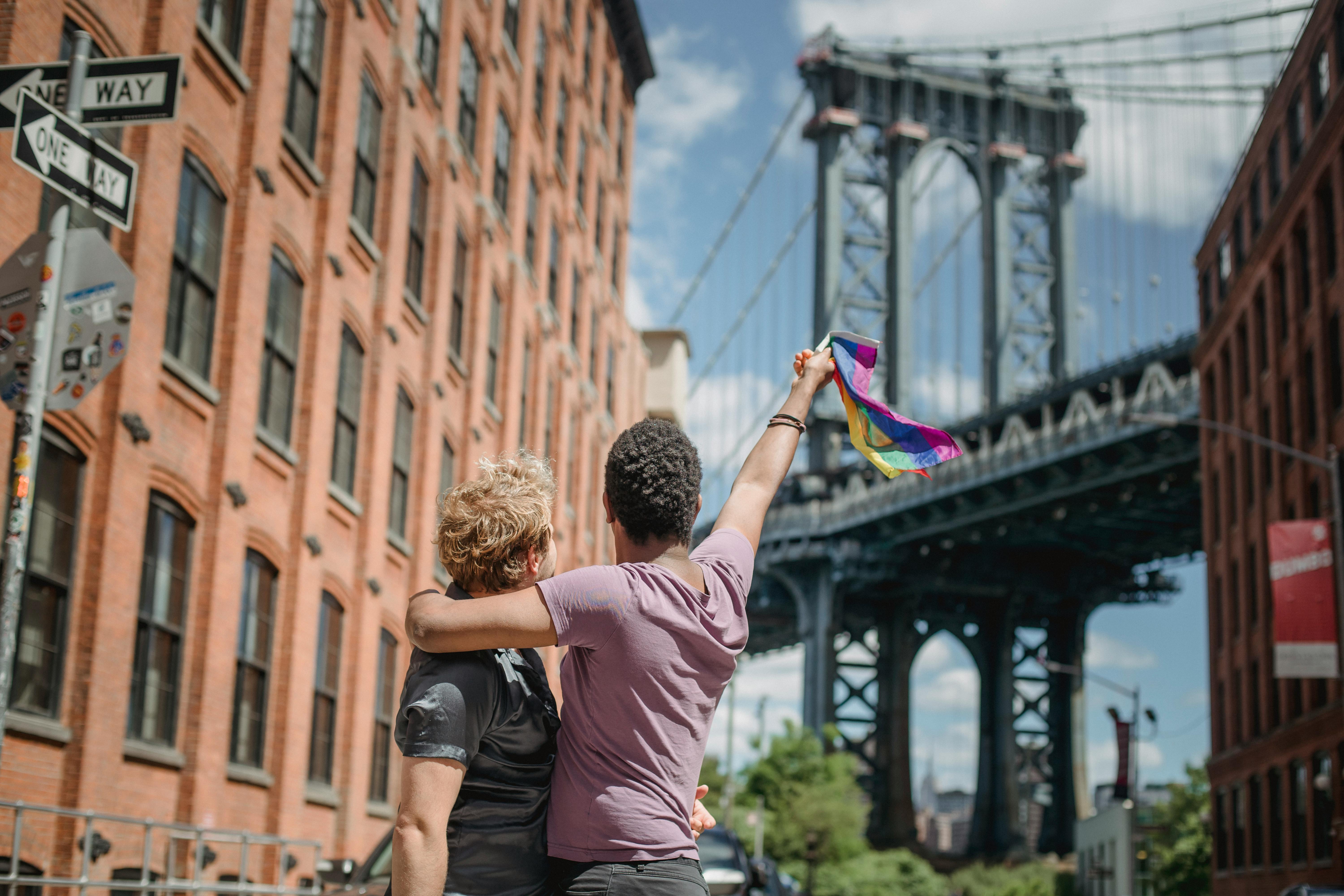 couple holding a lgbt flag