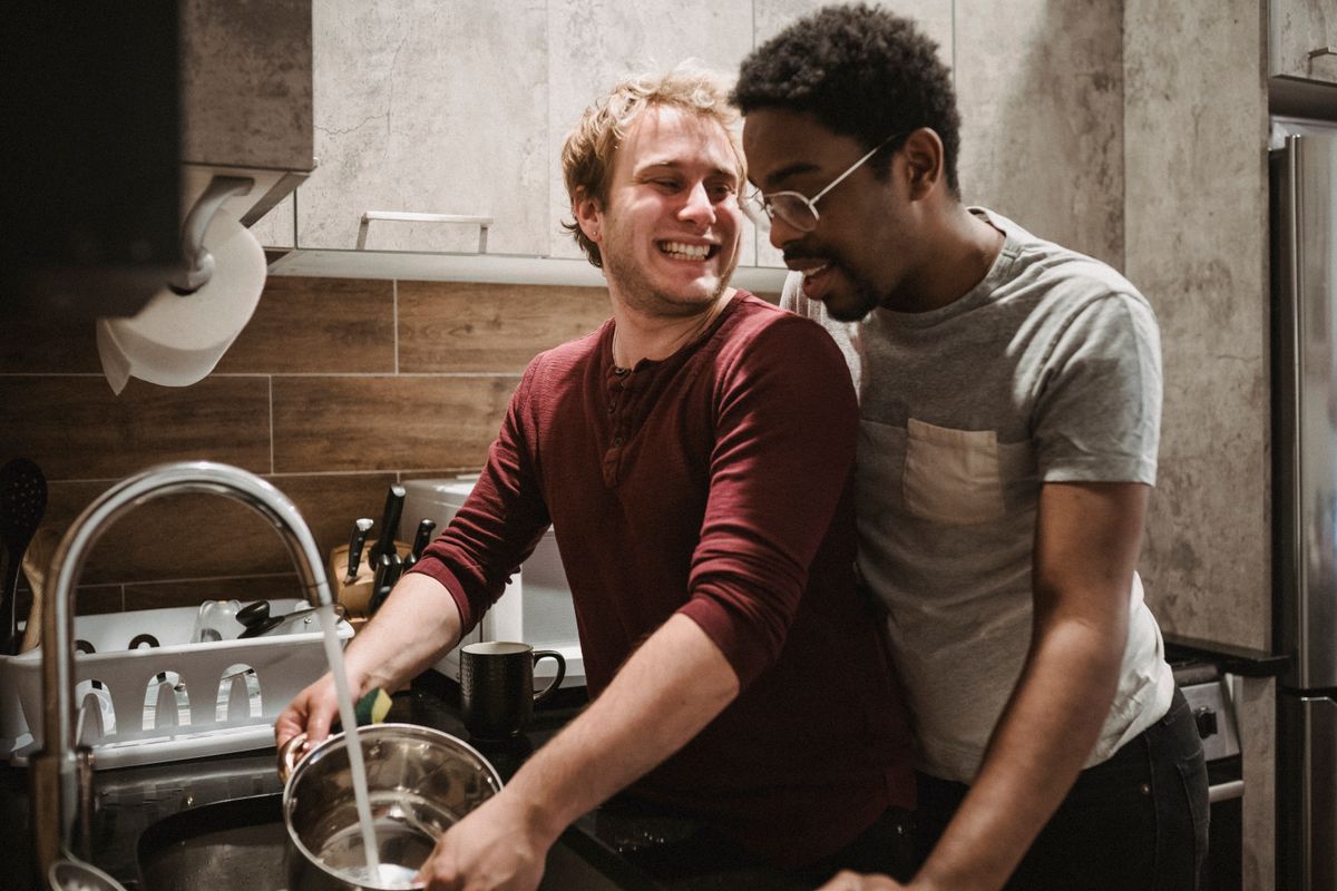 Two men enjoying cooking together