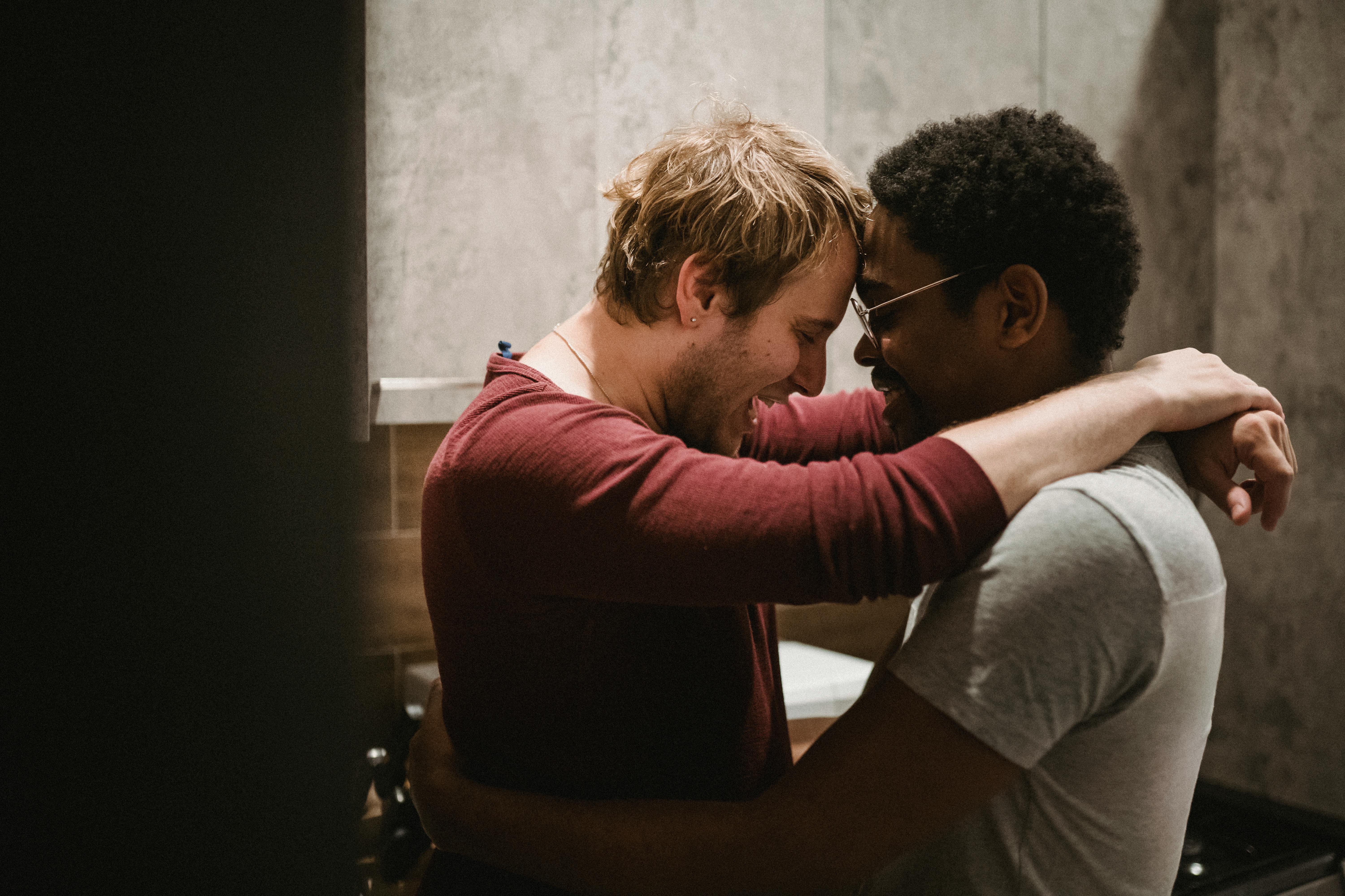 two men touching foreheads