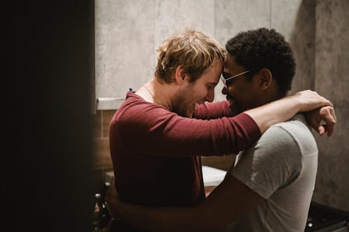 Two Men Touching Foreheads