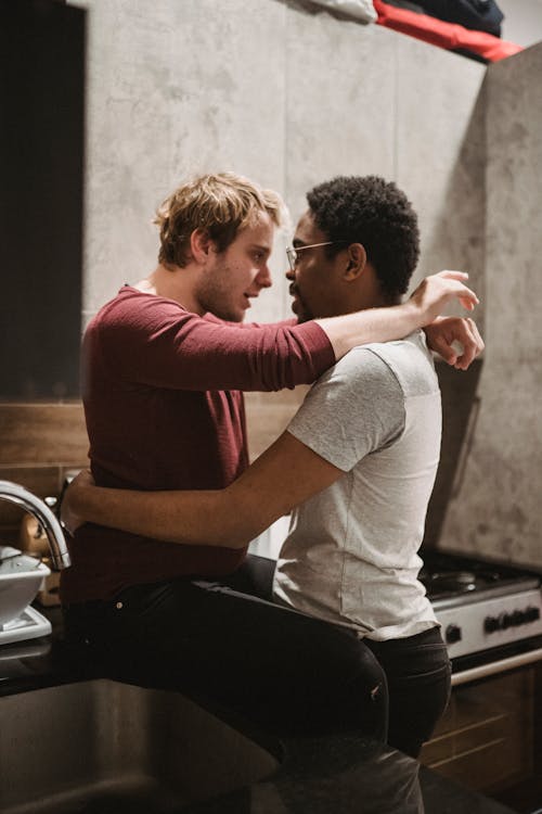 Free Two Men Embracing Each Other Stock Photo