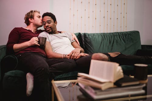 Two Men Cuddling on a Couch