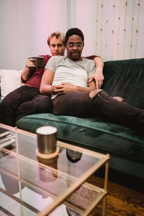 Two Men Relaxing on a Couch
