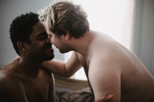 Free Two Shirtless Men Being Affectionate Stock Photo
