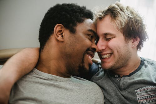 Two Men Touching Foreheads and Smiling
