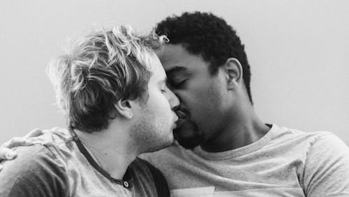 Grayscale Photography of Two Men Kissing