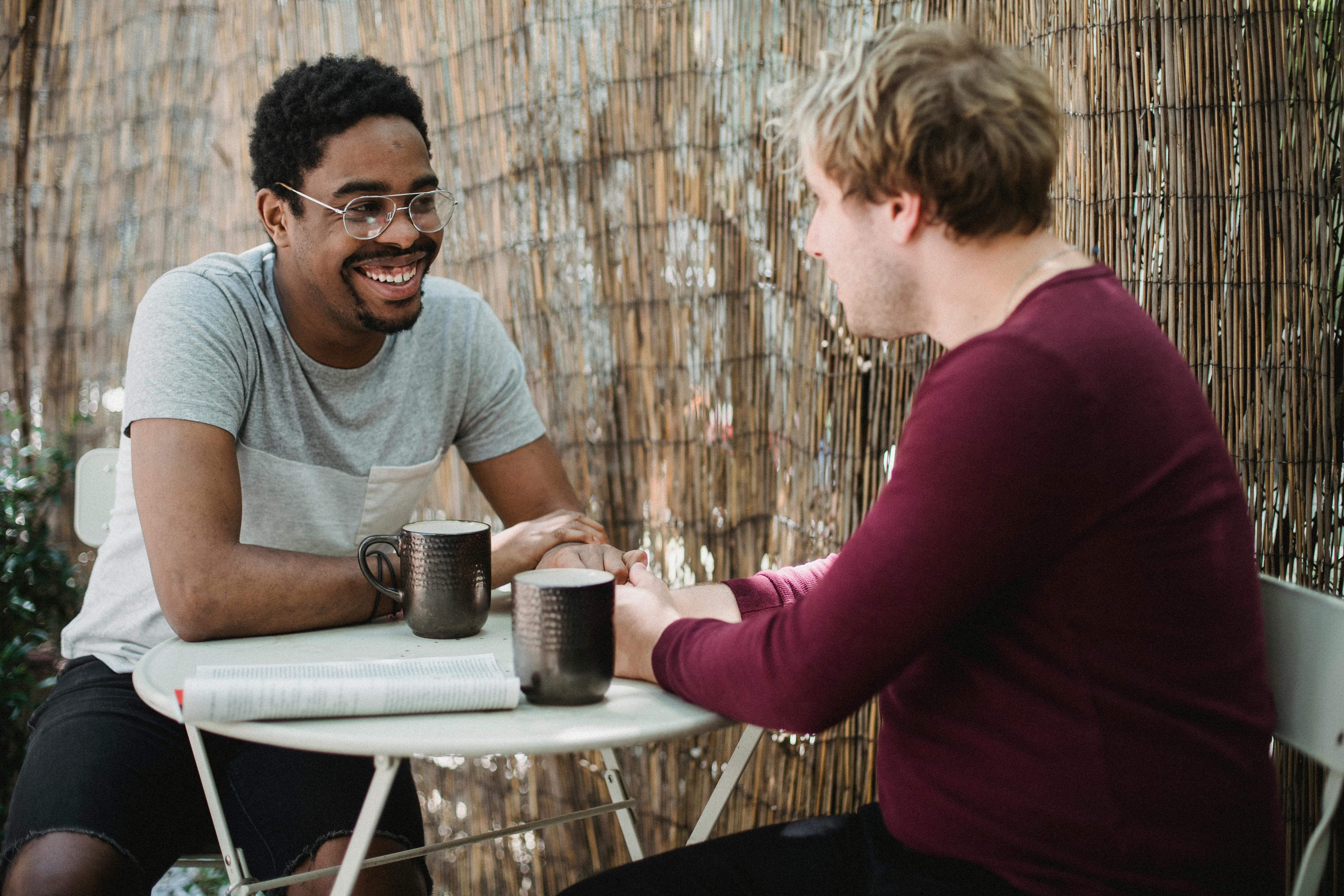 two men sitting at a table