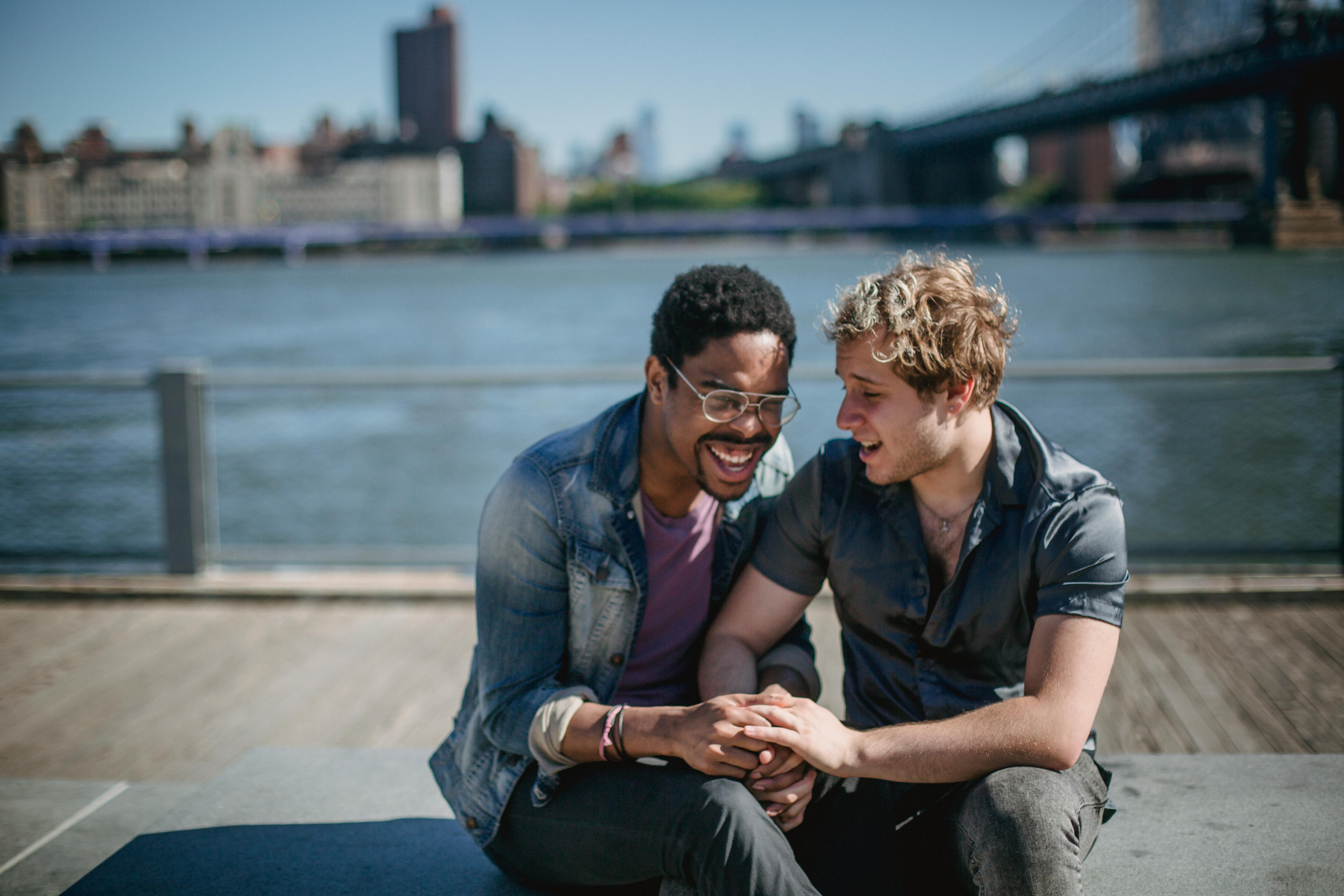 two men holding hands