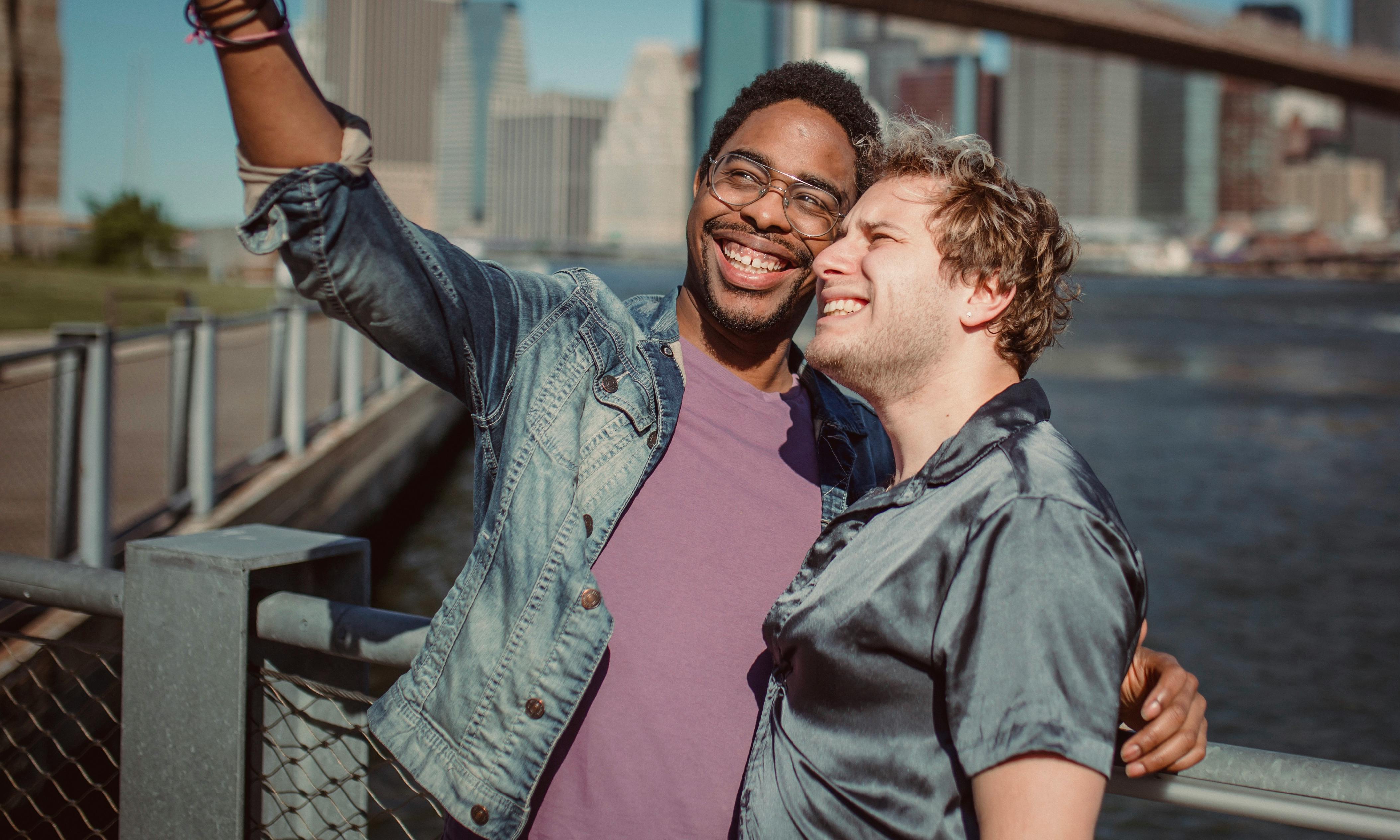 two men smiling and posing