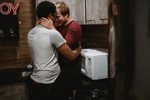 Free Two Men Being Affectionate Stock Photo