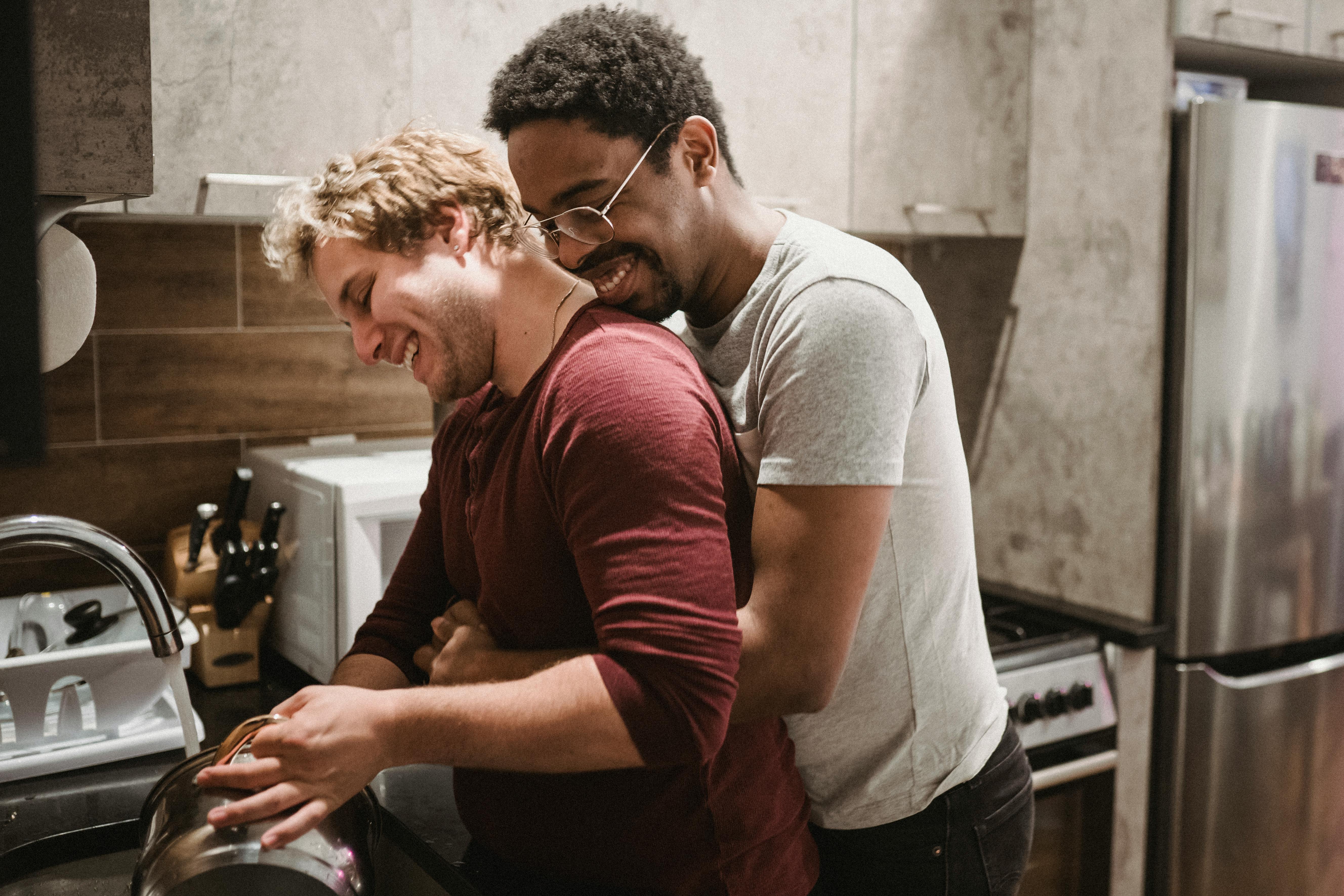 man hugging another man from behind