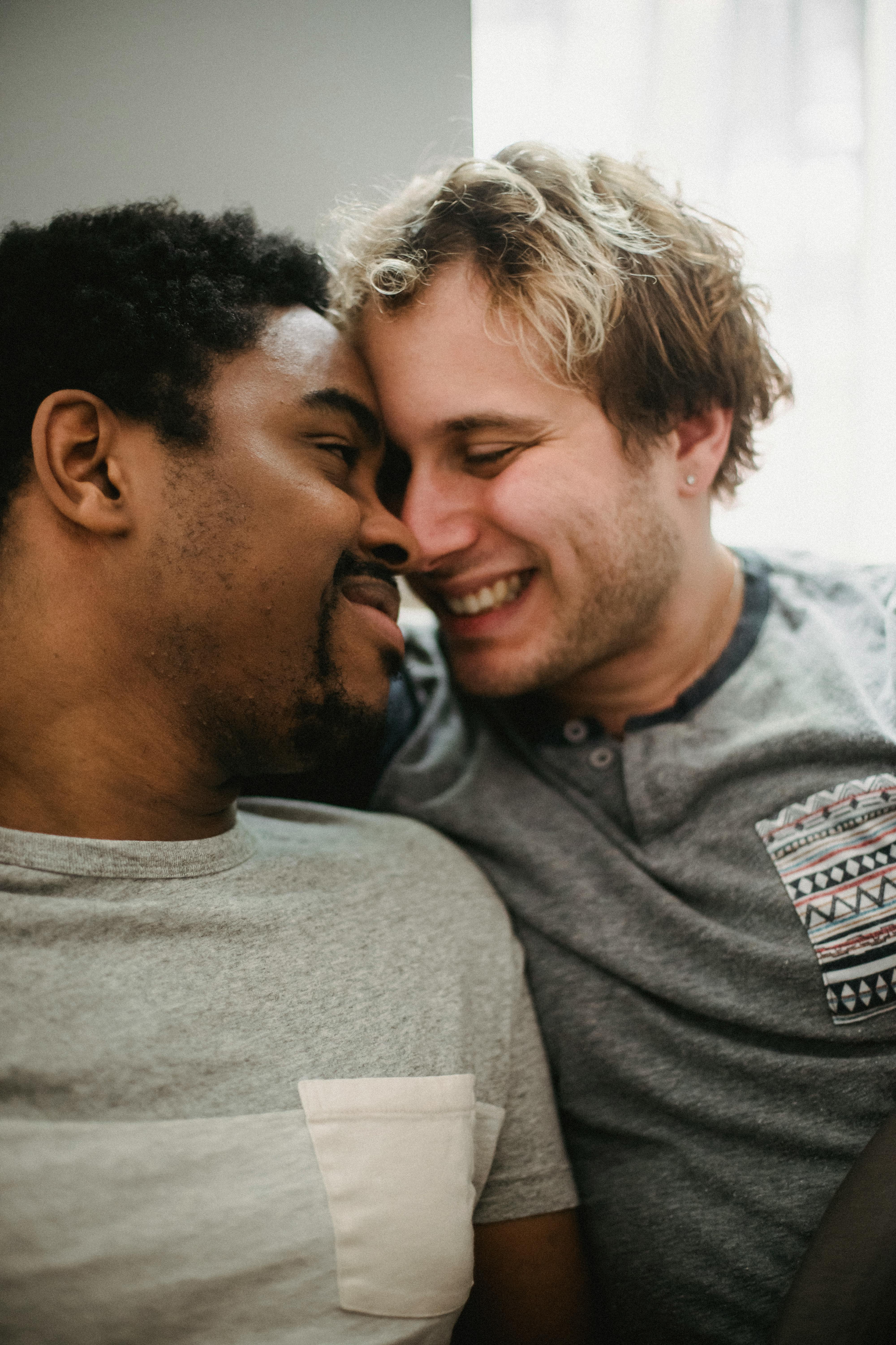 two happy men being affectionate