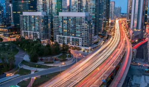 Free Stunning view of Toronto's bustling city streets and skyscrapers captured at twilight. Stock Photo