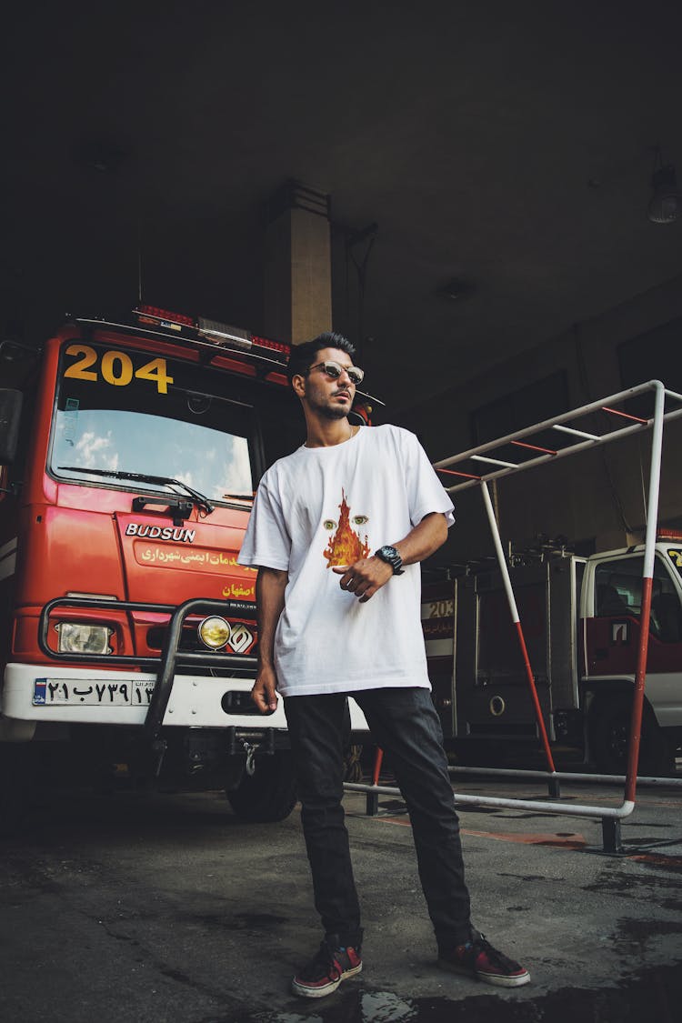 Portrait Of A Man Posing In Front Of A Truck