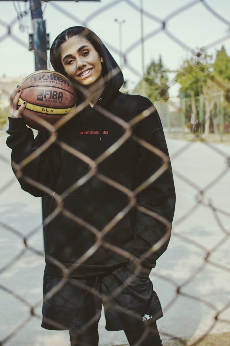 Portrait Of A Woman Holding A Basketball