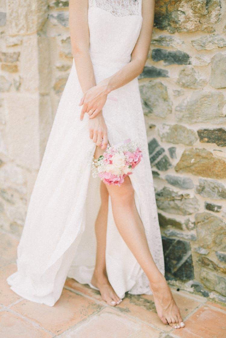 Person Standing While Holding Bridal Bouquet