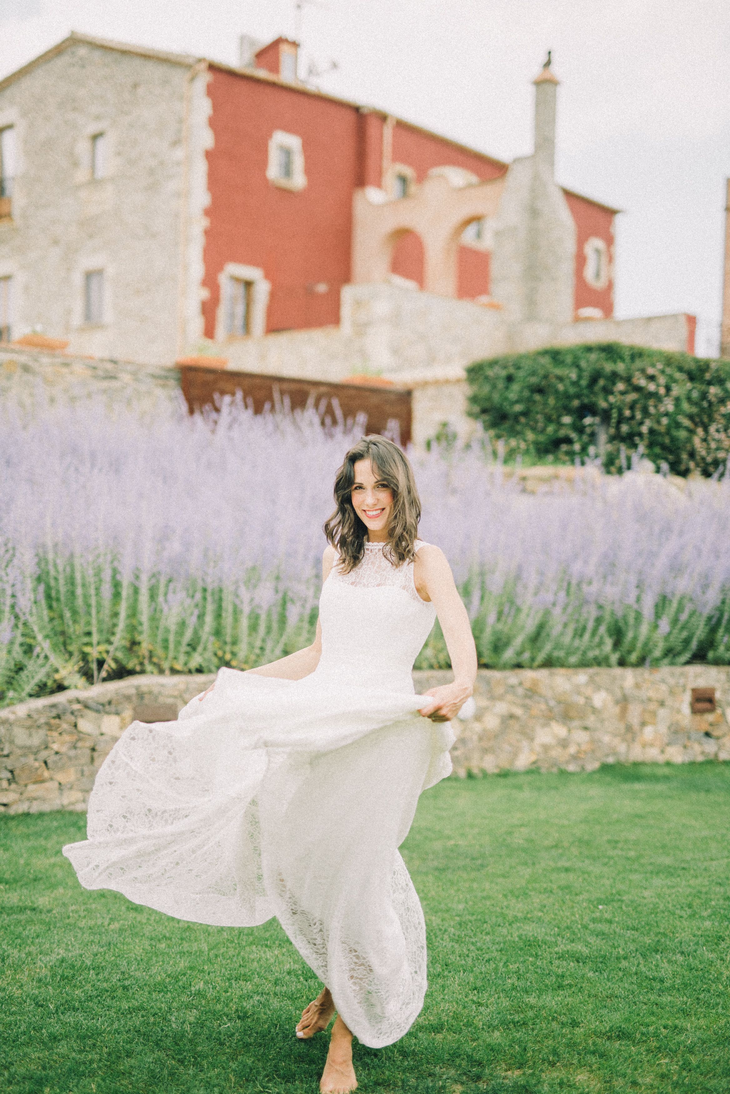 Woman in Wedding Dress Sitting on Grass While Smiling · Free Stock Photo