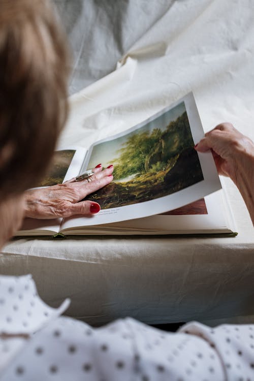 Free Person Holding White Printer Paper Stock Photo