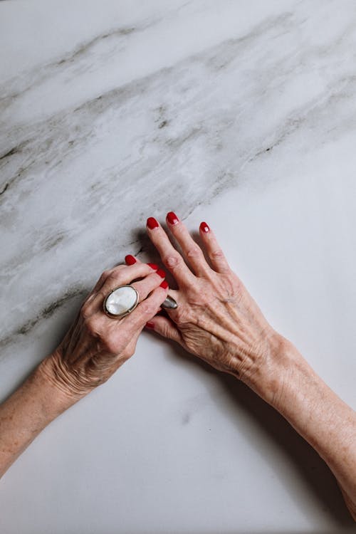 Person Holding White Round Ornament